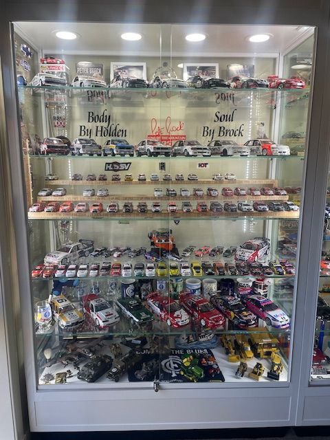 Showcase your collection in style with a glass display cabinet with lights, perfect for figurines, memorabilia, and more.
