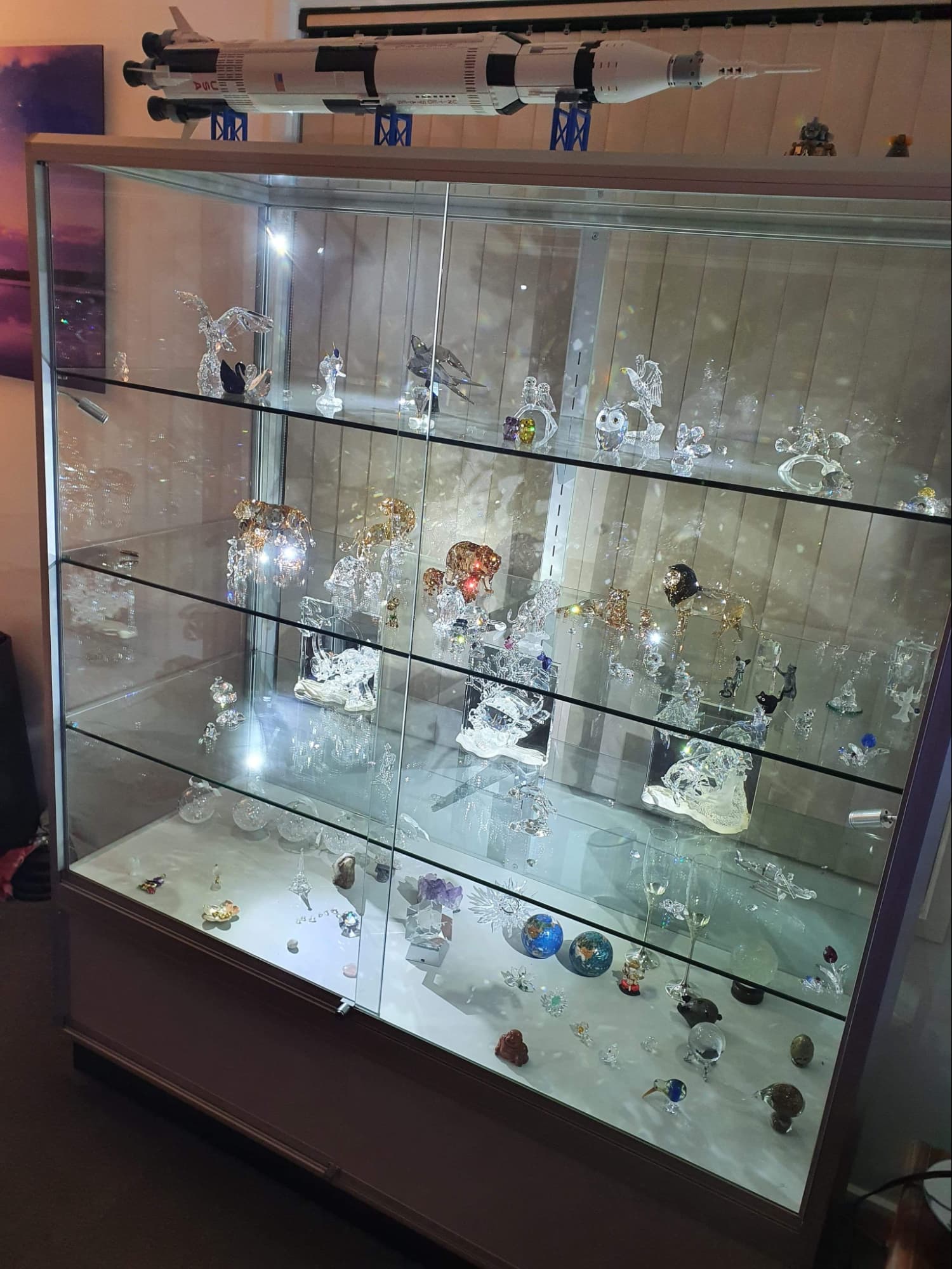 Keep your collectibles secure and illuminated in a glass cabinet with lights, designed for maximum visibility.