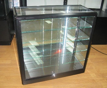 Custom Black Cabinet with Glass Shelves by Showfront