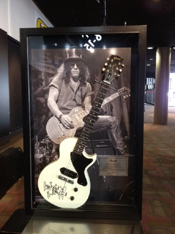 Custom guitar wall display case created by Showfront for signed guitar from Slash.