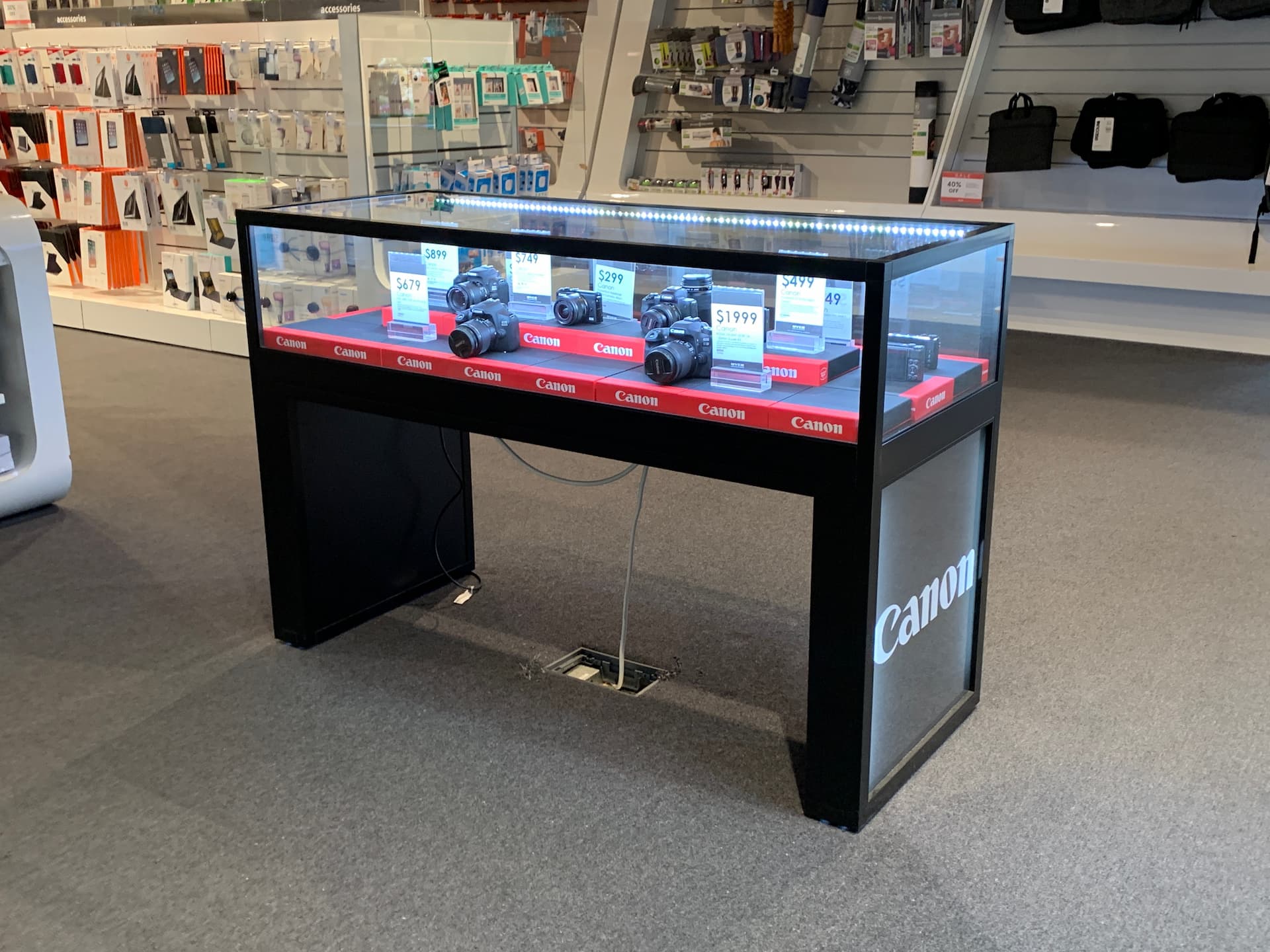 Custom electronics retail display shelving and cabinets crafted by Showfront.