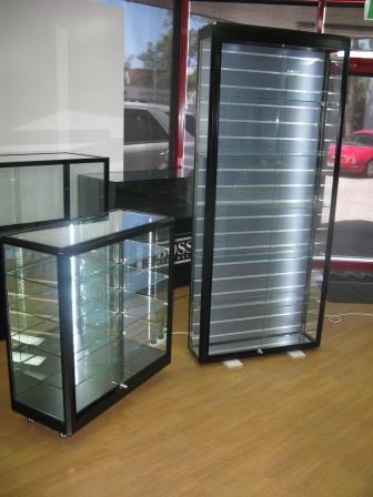 Custom Black Tower with Slatwall and Cabinet by Showfront