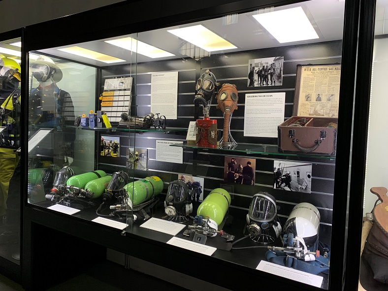 The tools and equipment of firefighters from the past are displayed in this customised museum display case fitted with lockable sliding glass doors and LED lighting. 