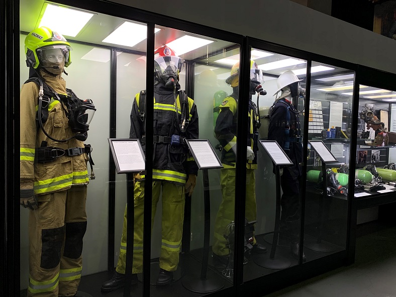 The DMANQ1600S museum display case from Showfront was the perfect solution for the display of these firefighting uniforms. 