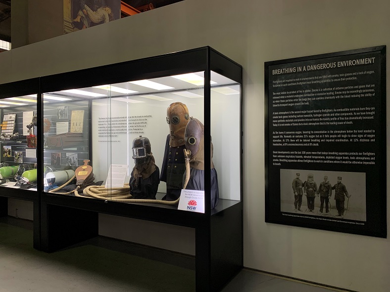 Alt tag: Historic firefighting protective equipment is put on show while stored safely and securely in the TUC2400 Showfront museum display case. 
