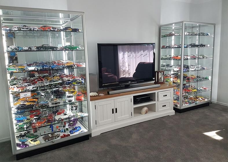 Matt has 2 duplicate silver TGL 100 display cabinets for his model car collection in his lounge room.