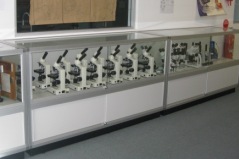 Laboratory Display Cabinets with Microscopes by Showfront